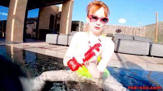 Red XXX fucks her pussy with a toy in the pool