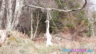 Naked self-bondage in the woods gone wrong.